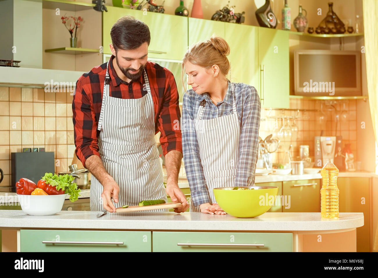 Young couple cooking, vegetables Stock Photo - Alamy