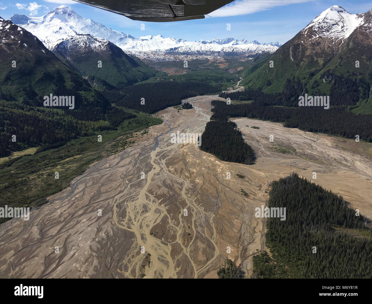 Braided Rivers   . An aerial image of braided rivers backdropped by the snowy Iliamna Volcano. Stock Photo