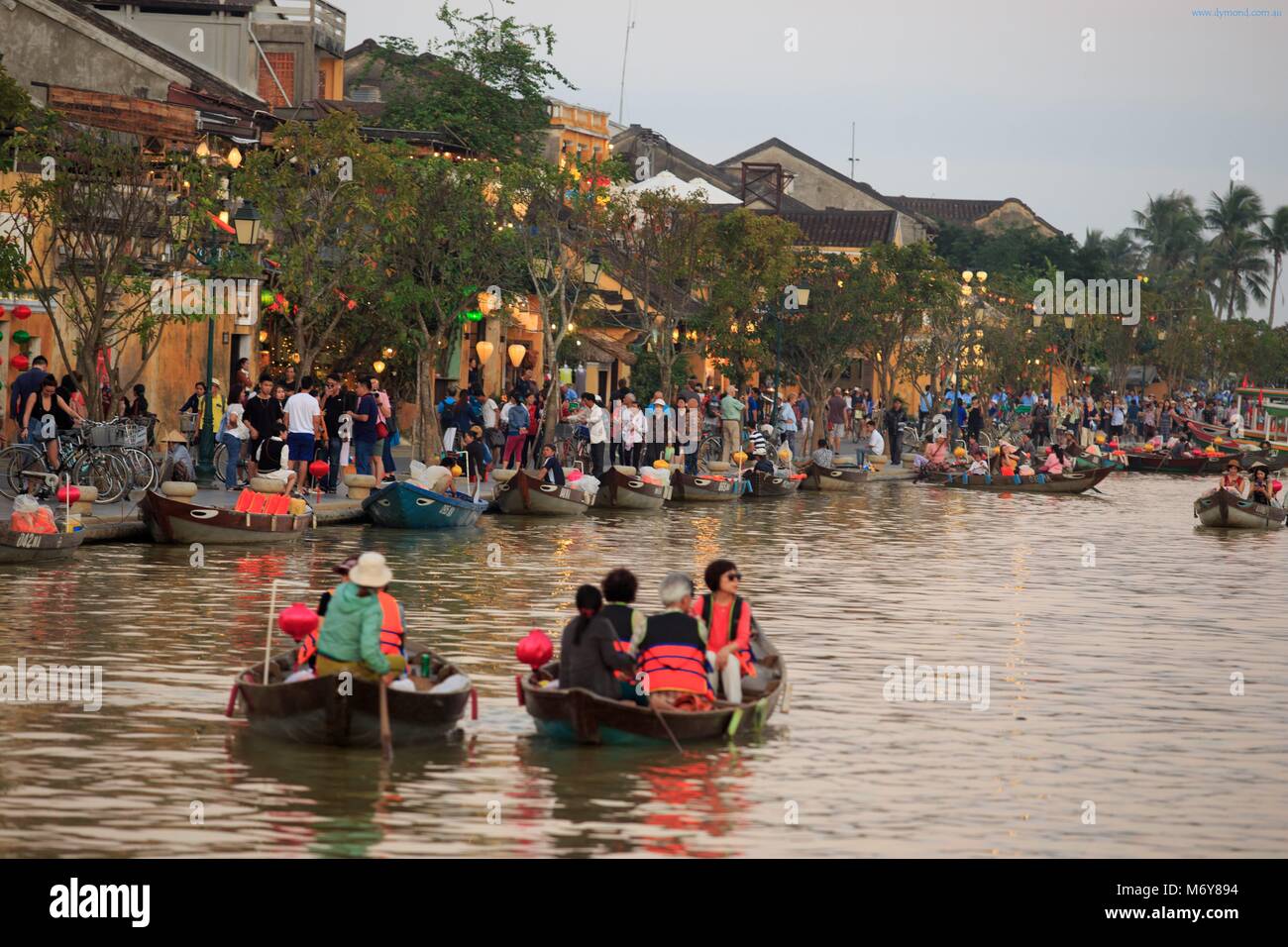 A boat trip on the Thu Bon river is a popular activity for locals and tourists alike in Hoi An, Vietnam Stock Photo