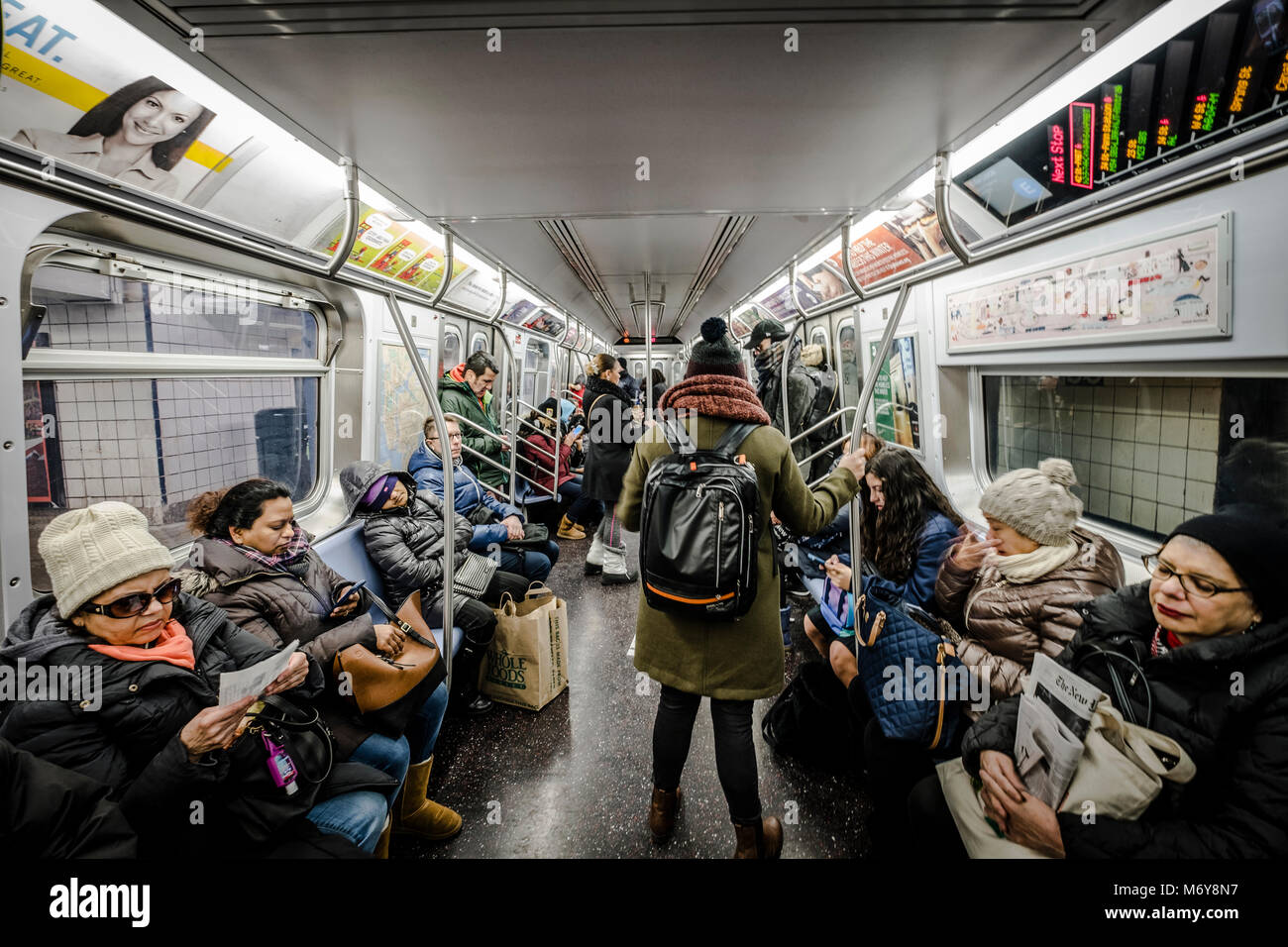 Commuters in subway wagon at New York subway system Stock Photo - Alamy
