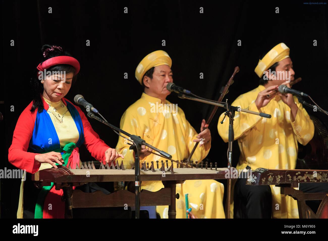 Musicians provide narration and music during a performance at the Golden Dragon Water Puppet Theatre in Ho Chi Minh City, Vietnam Stock Photo