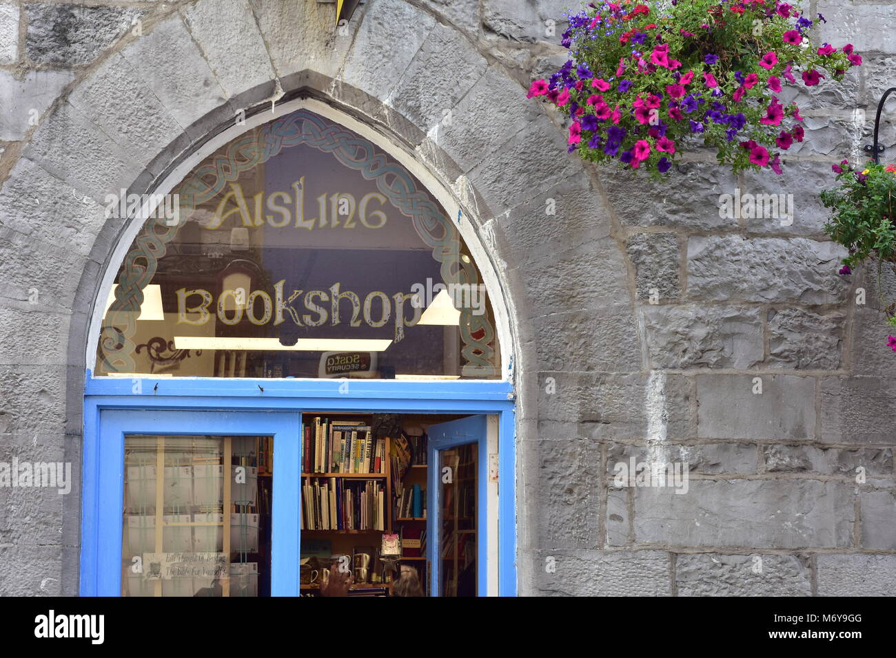 Arched window on historical stone building of Aisling Christian