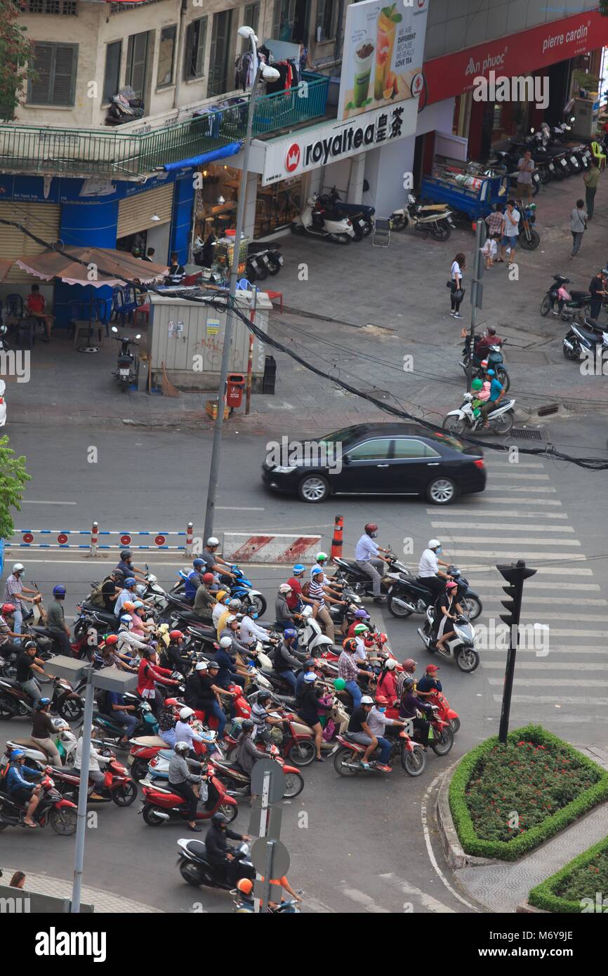 Crazy traffic at a crowded intersection in District 1 of Ho Chi Minh City, Vietnam Stock Photo