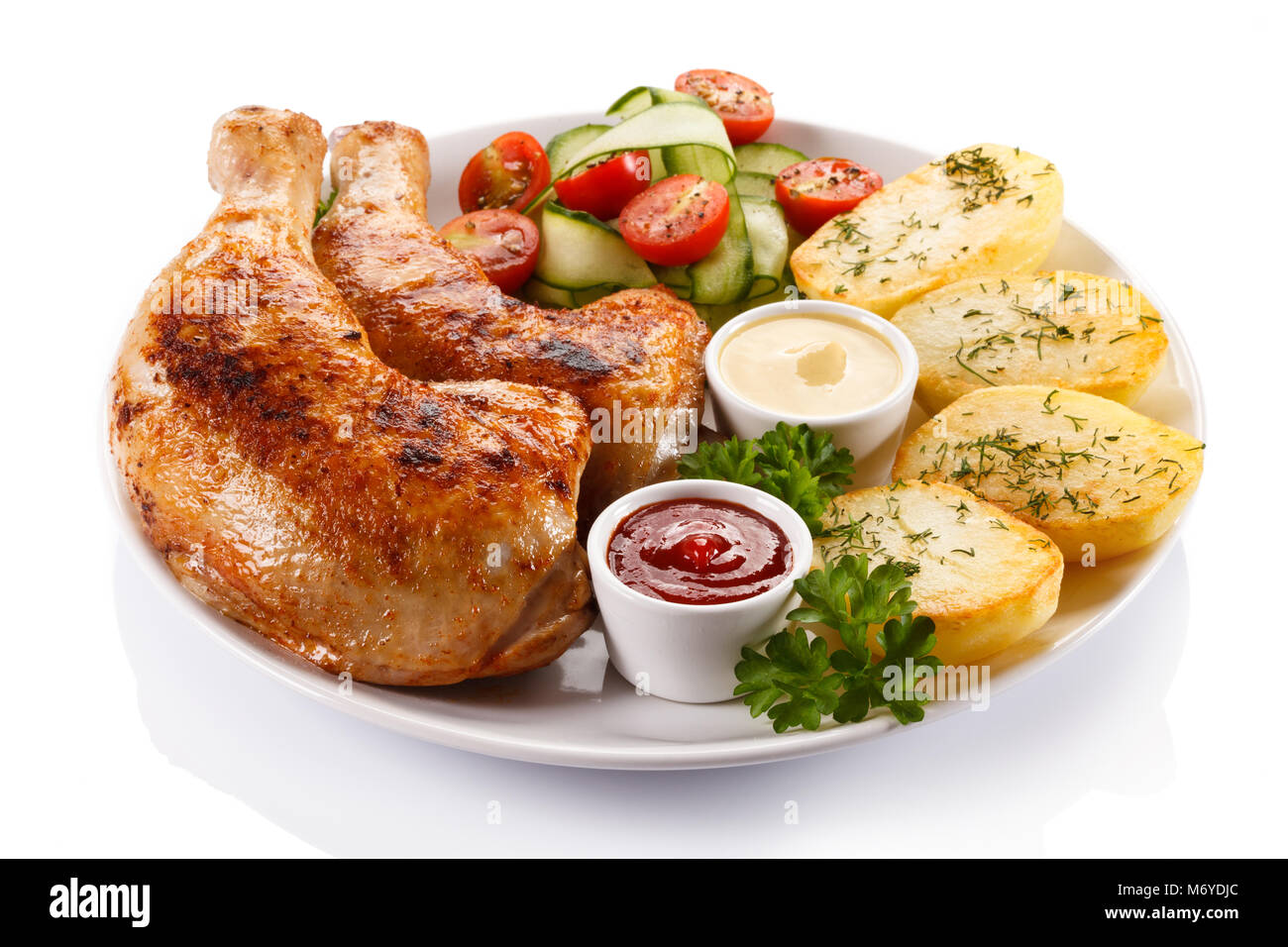 Roasted chicken leg and vegetables Stock Photo - Alamy