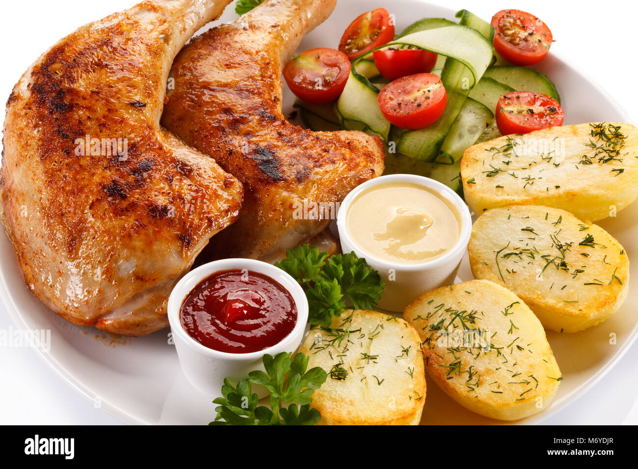 Roasted chicken leg and vegetables Stock Photo - Alamy