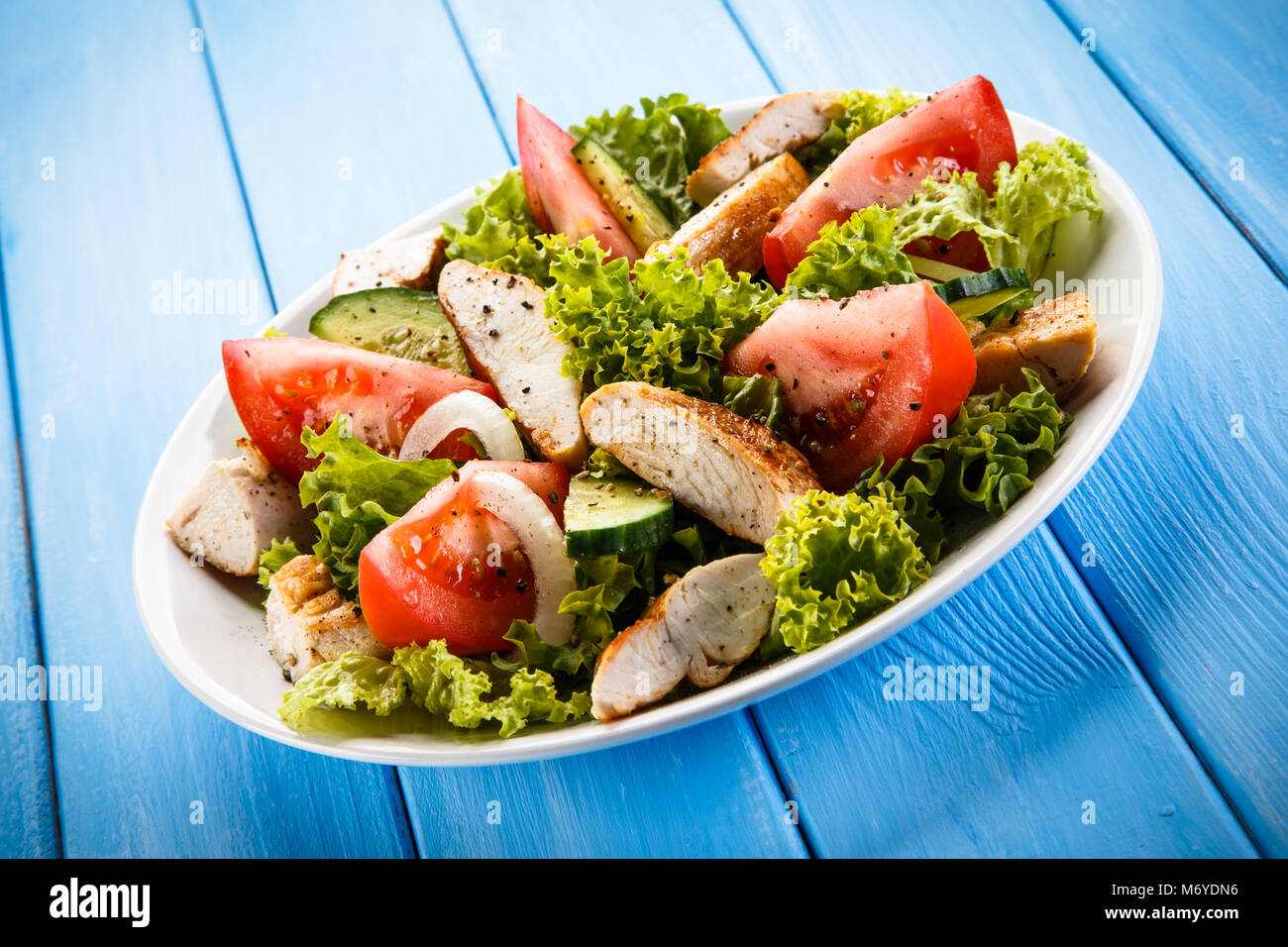 Greek salad with grilled chicken Stock Photo