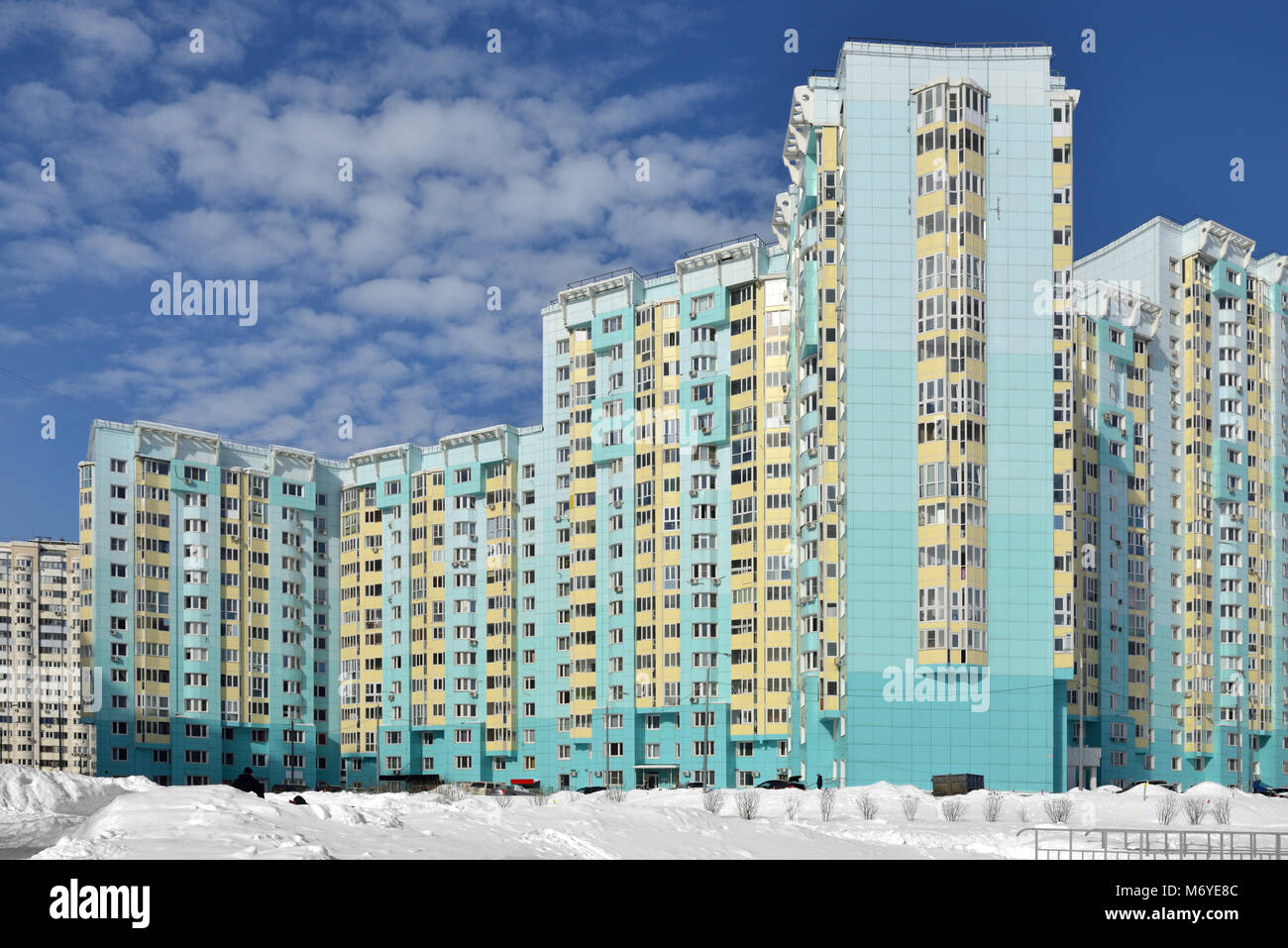New residential building against blue sky with clouds in winter Stock ...