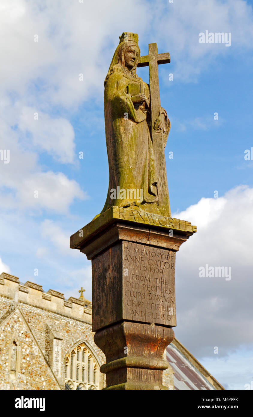 A carved wooden memorial statue outside the parish Church of St Helen at Ranworth, Norfolk, England, United Kingdom, Europe. Stock Photo
