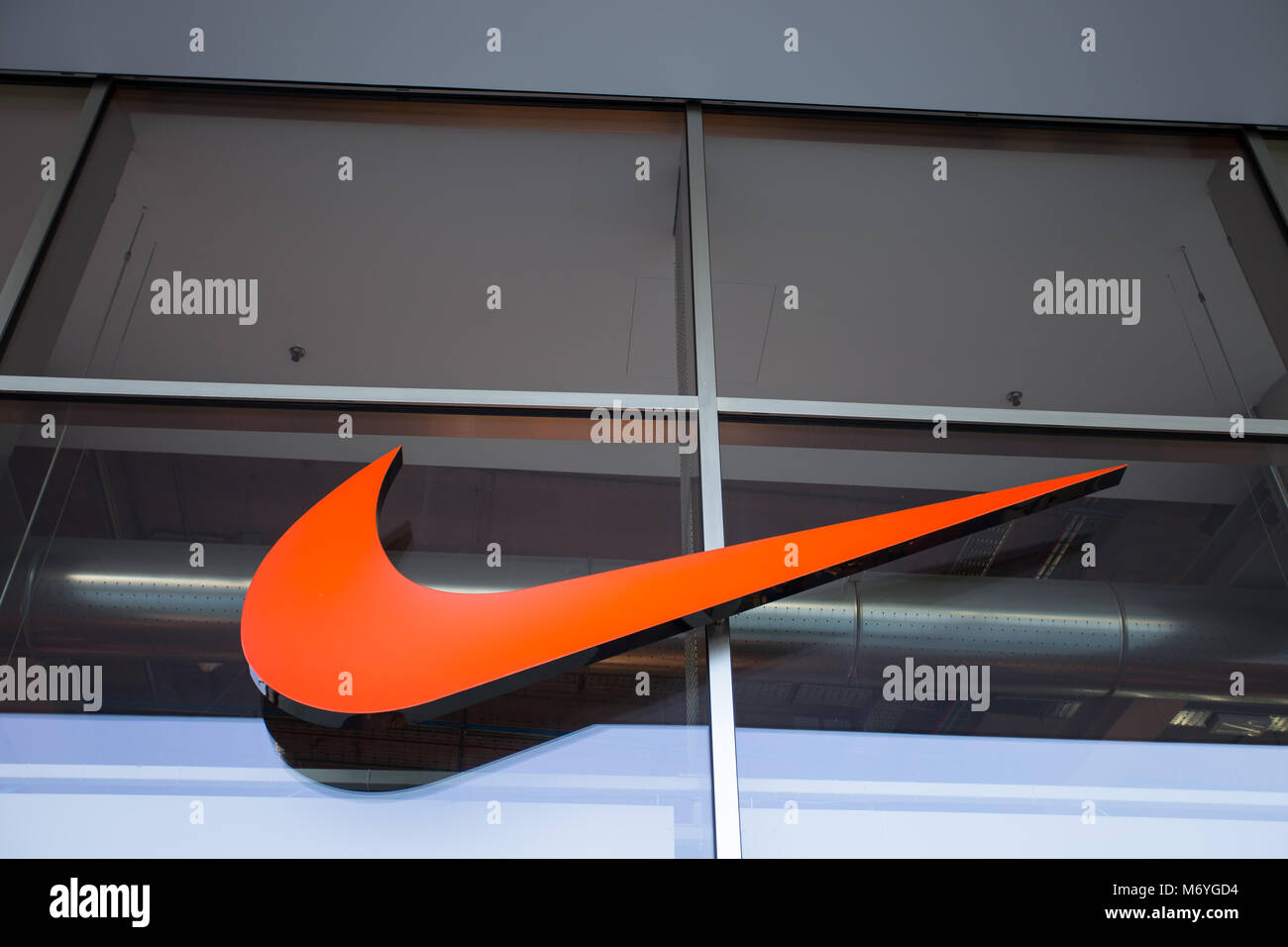 MILAN, ITALY, MARCH 28, 2017 Nike brand logo. Nike is a global sports clothes and running shoes retailer. Nike stores are located all over the world Stock Photo
