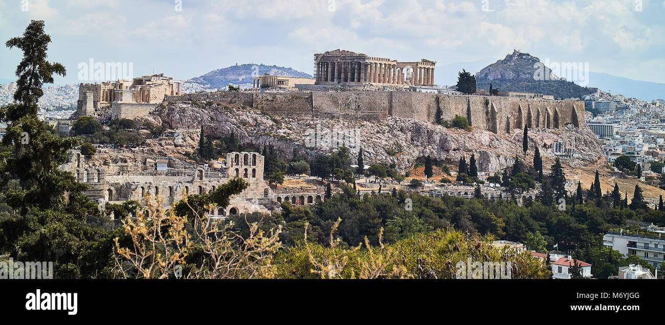 Europe, The Acropolis of Athens, shot in July 2017. World famous as a symbol of democracy and ancient civilization is a magnet for tourists. Under the Acropolis sits the old town of Athens, named Plaka with its colorful houses. On the righmost of the picture lies the Mars Hill, an ancient site which can be visited for free and gives excellent views of the city. Stock Photo