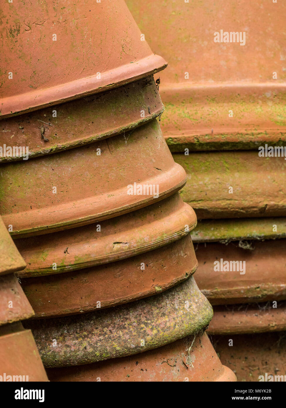 Close up of a stack of old terracotta plant pots Stock Photo