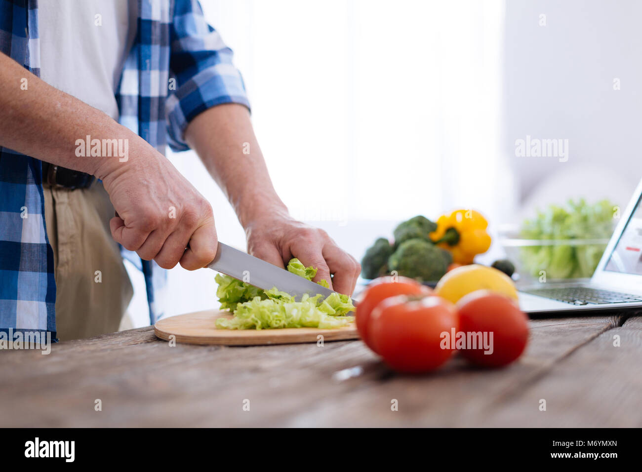 Male young hands shredding lettuce Stock Photo Alamy