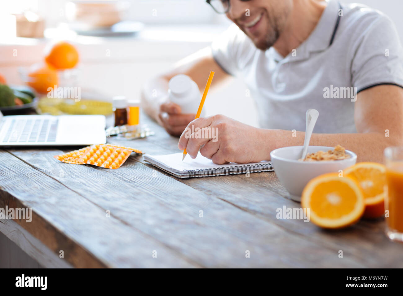 Male hands classifying biohacking supplements Stock Photo