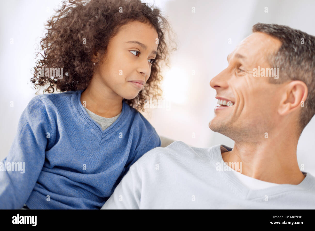 Happy father looking at his daughter Stock Photo