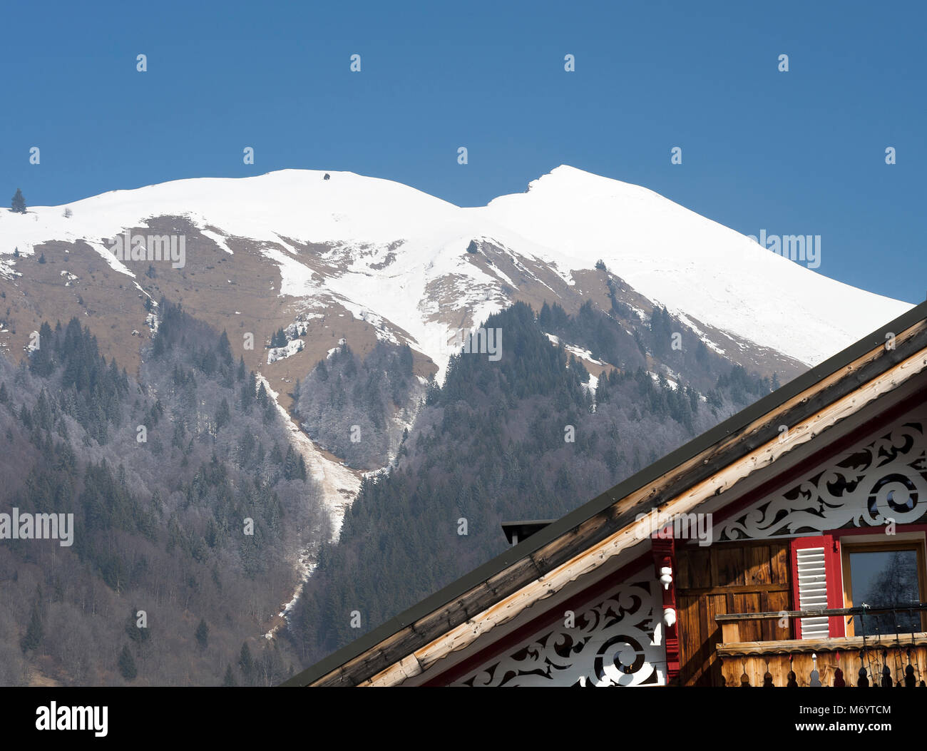 Modern Chalet in Morzine Haute Savoie Portes du Soleil France with the Snow Covered Pointe de Nantaux in the Backgroundd Stock Photo