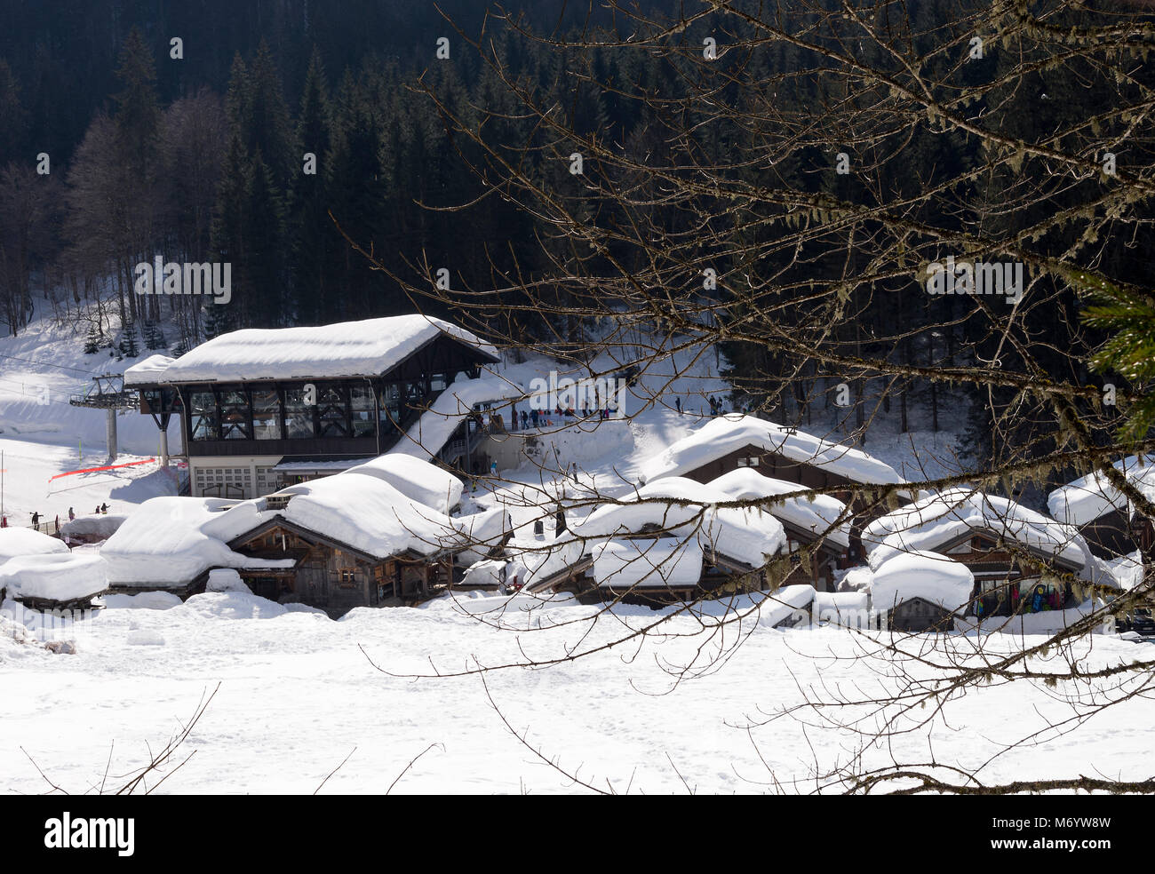 Snow Covered Rooves of Gondola Station and Chalet Style Shops, Restaurants and Accommodation near Avoriaz at Montriond Ski Resort Haute Savoie France Stock Photo