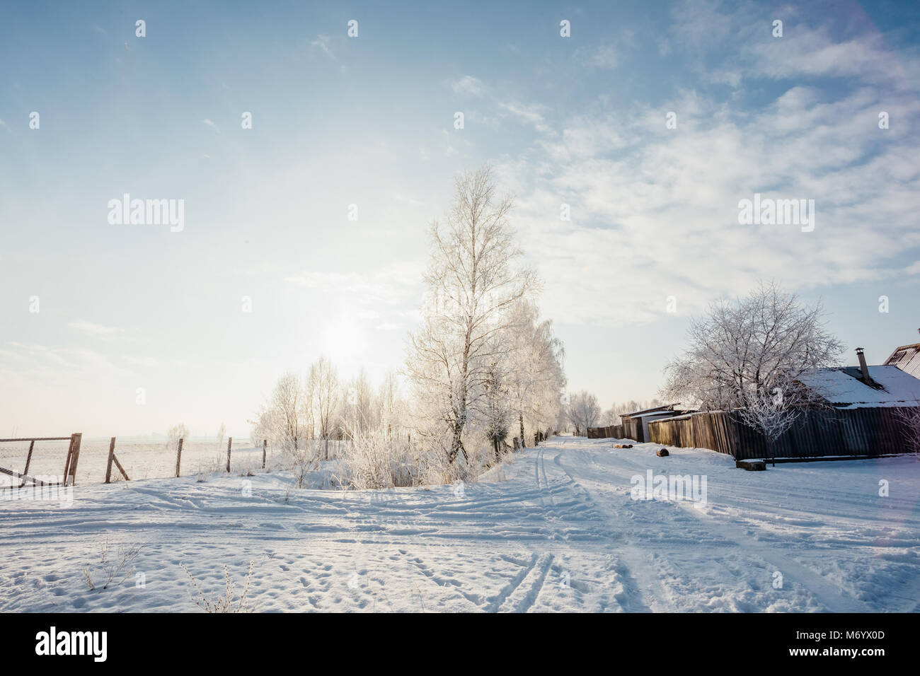 Winter landscape in the countryside streets of the village in snow and ...