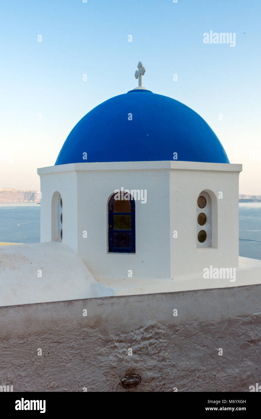 Church with blue roof in town of Oia and panorama to Santorini island ...