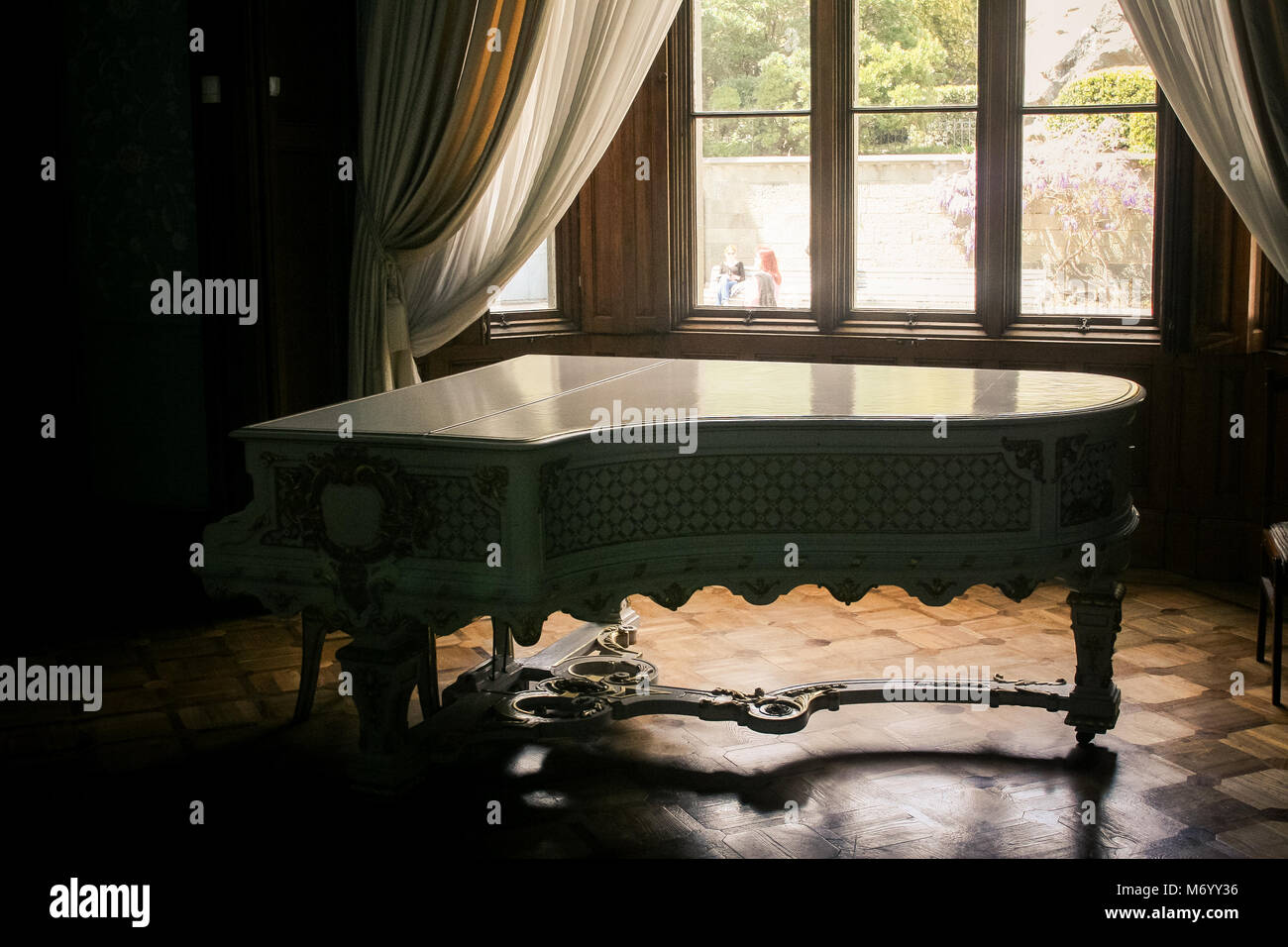 closeup Vorontsov palace interior room with white grand piano near lit ...