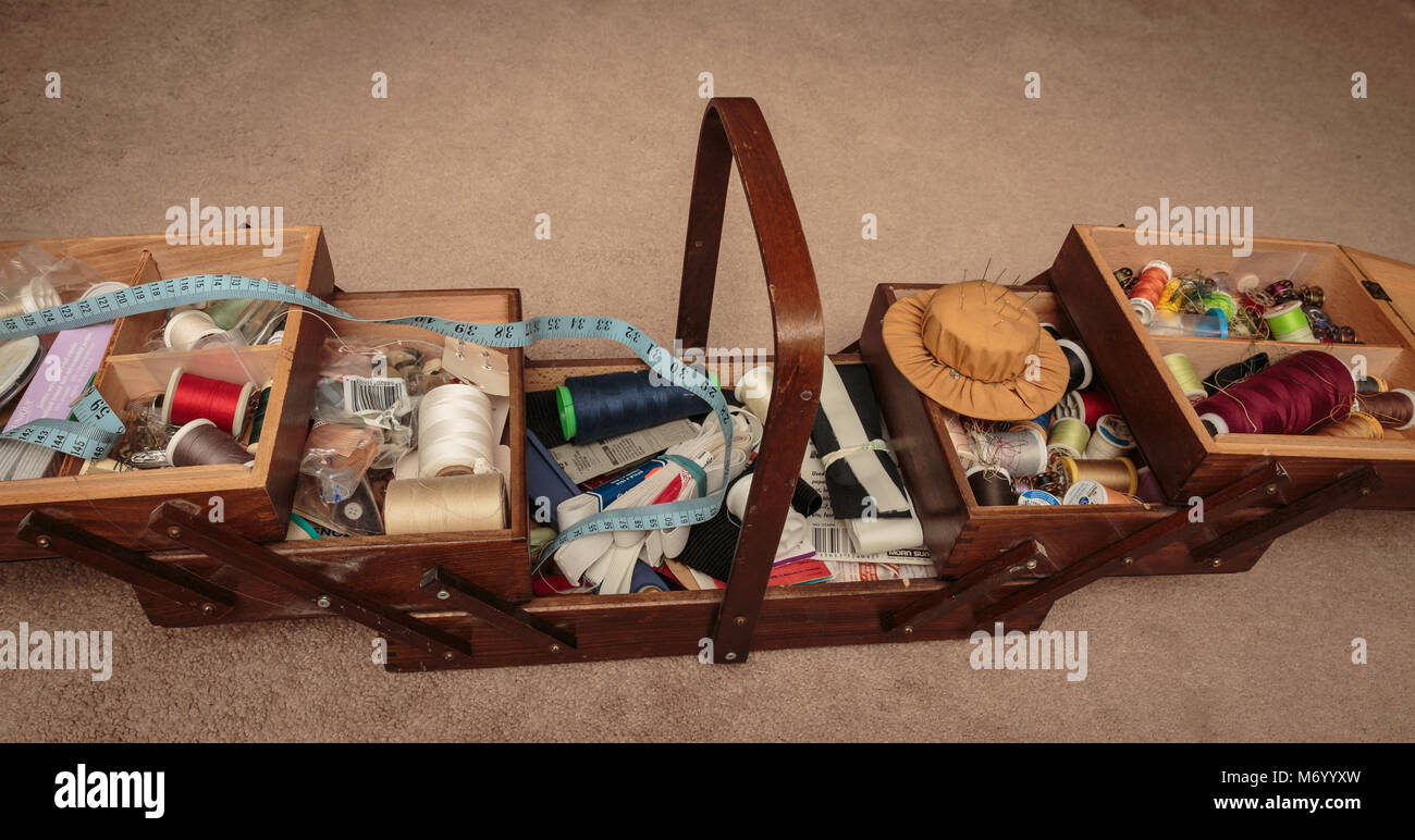 Contents of a sewing basket filled with sewing notions Stock Photo