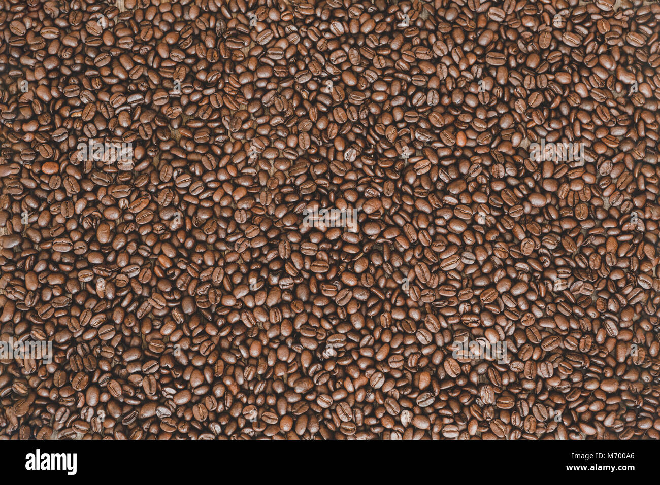 Rich brown roasted coffee beans background Stock Photo - Alamy