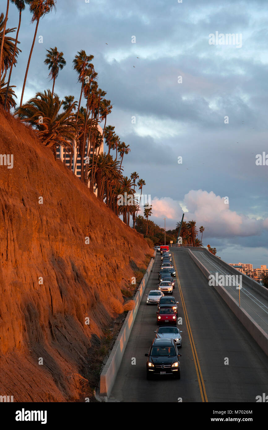 A road designated as the California Incline connects Santa Monica with the Pacific coast Highway below the ocean side cliffs in Los Angeles, CA Stock Photo