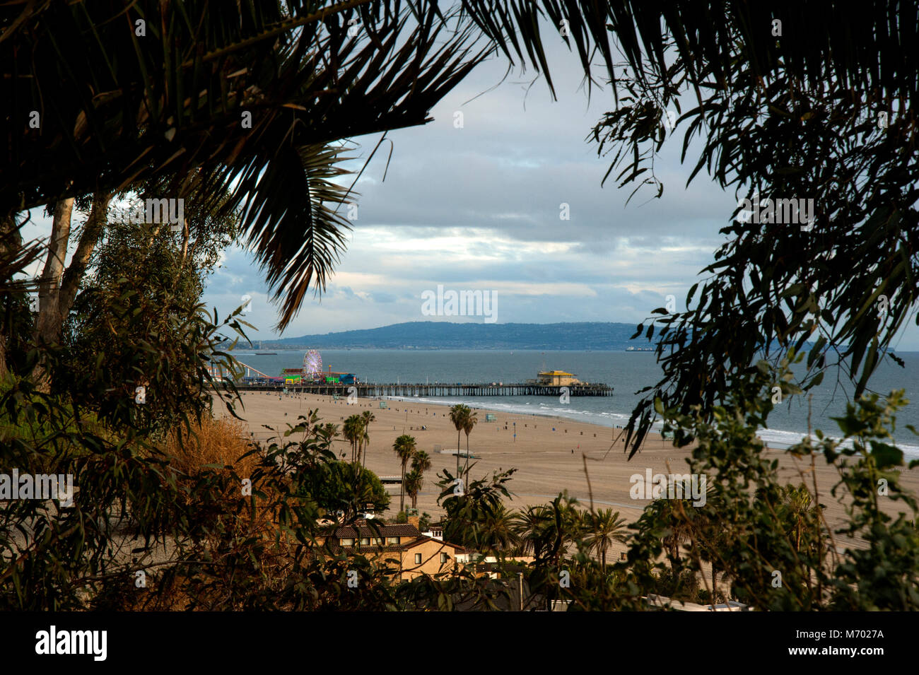A scenic view of the Santa Monica Pier from Palisades Park on the cliffs overlooking the Pacific Ocean at Los Angeles, CA Stock Photo