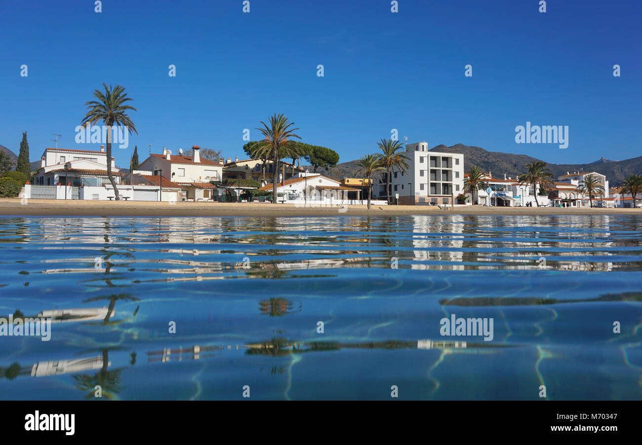 Buildings along the beach seen from water surface, Spain, Costa Brava, Mediterranean sea, Roses, Catalonia, Girona Stock Photo