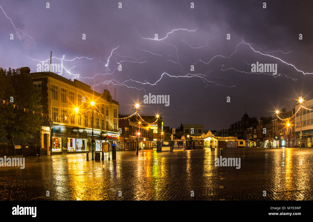 A thunderstorm over a market in Norfolk, UK Stock Photo