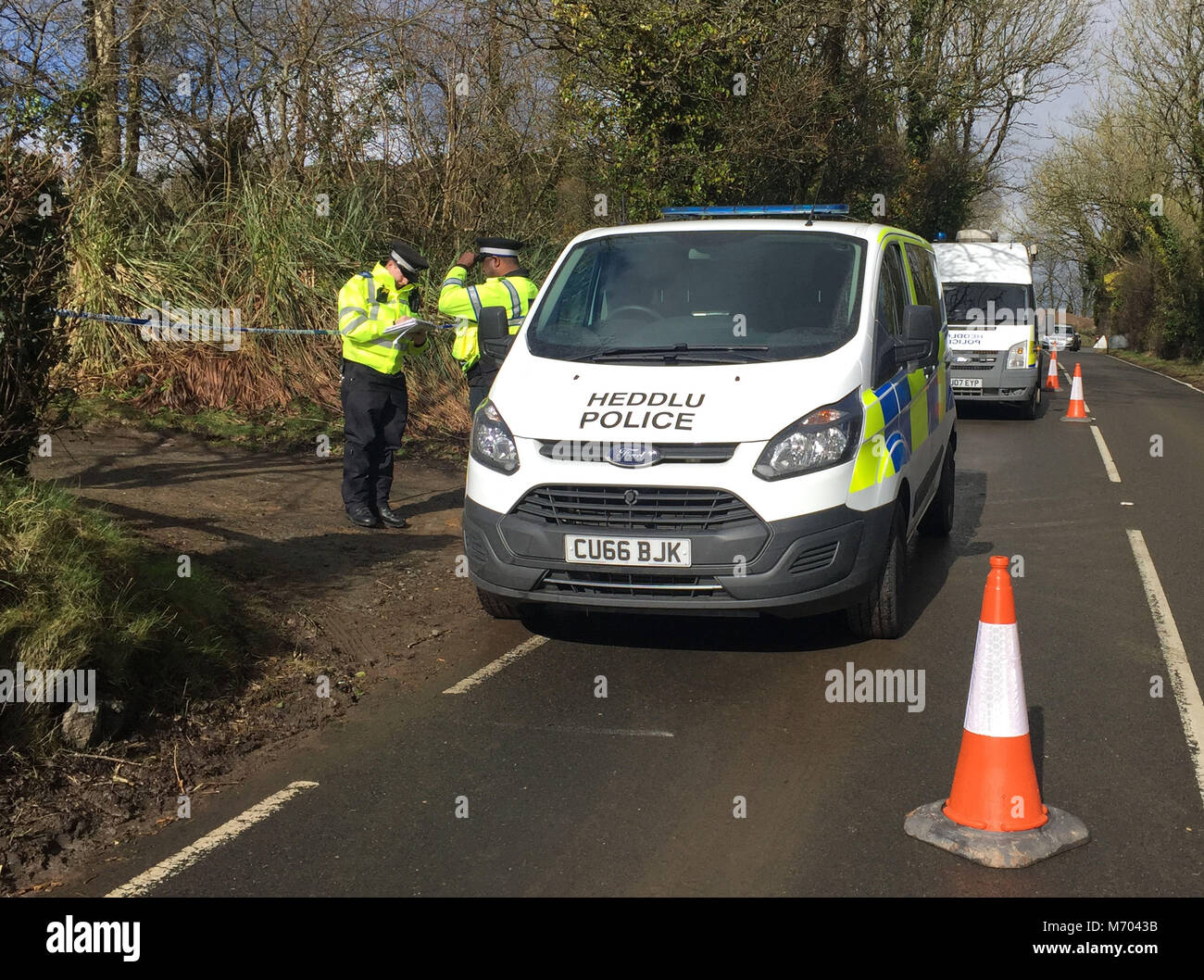 Police at an address in St Clears, Carmarthenshire, after a 16-year-old boy was arrested on suspicion of murder after the body of a female was found at a property in the small town in west Wales. Stock Photo