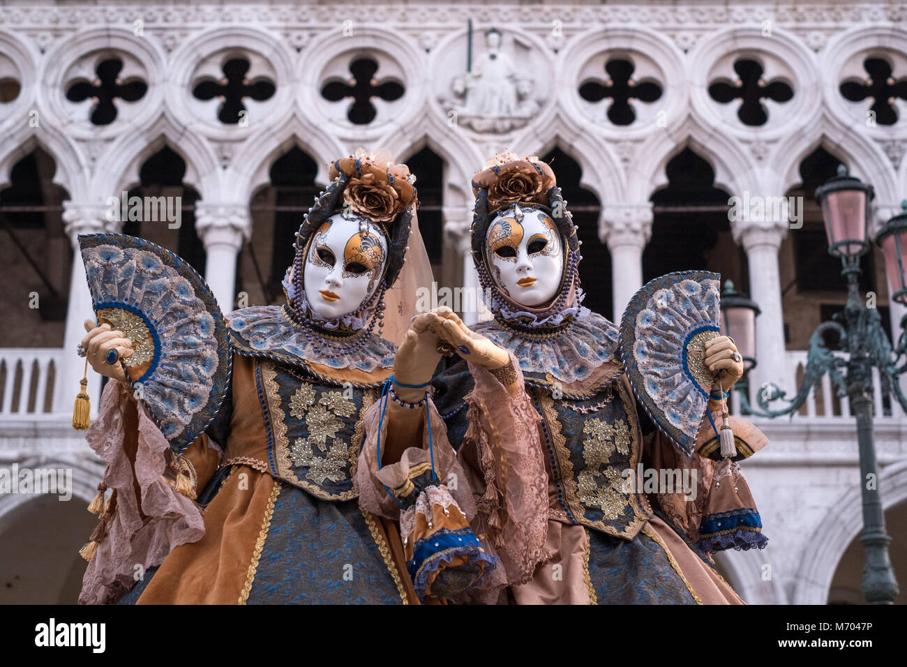 Two women in traditional costume and painted masks, standing in front Stock  Photo - Alamy