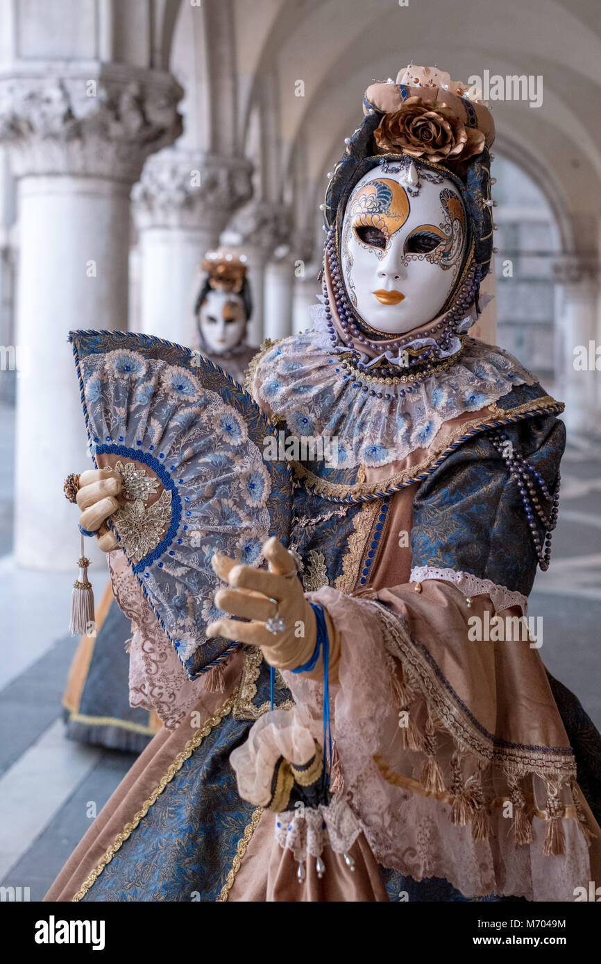 Two women in traditional costume and painted masks, standing in front Stock  Photo - Alamy