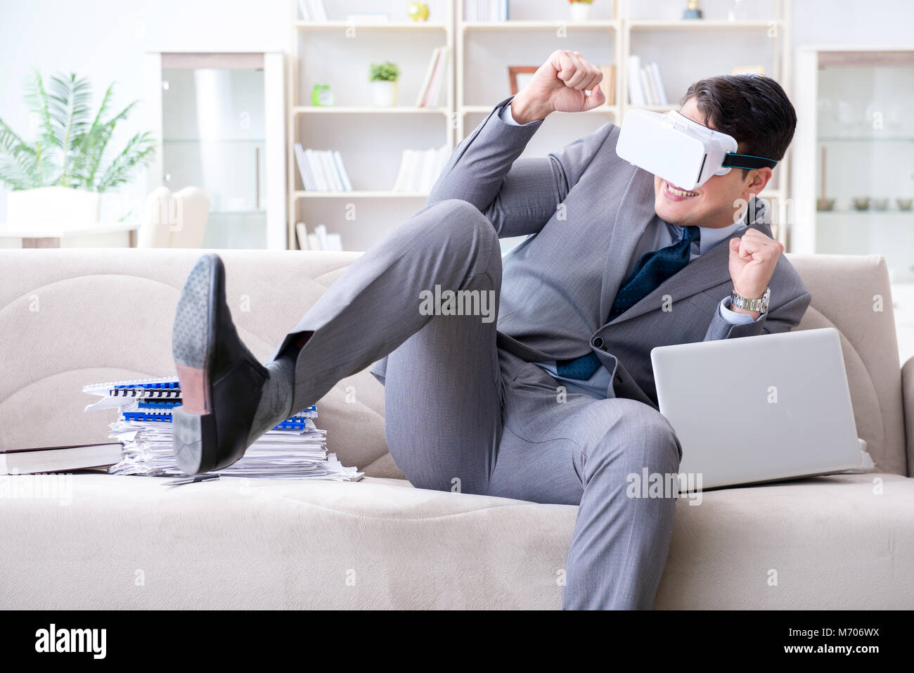 Businessman with virtual reality glasses in modern technology concept ...