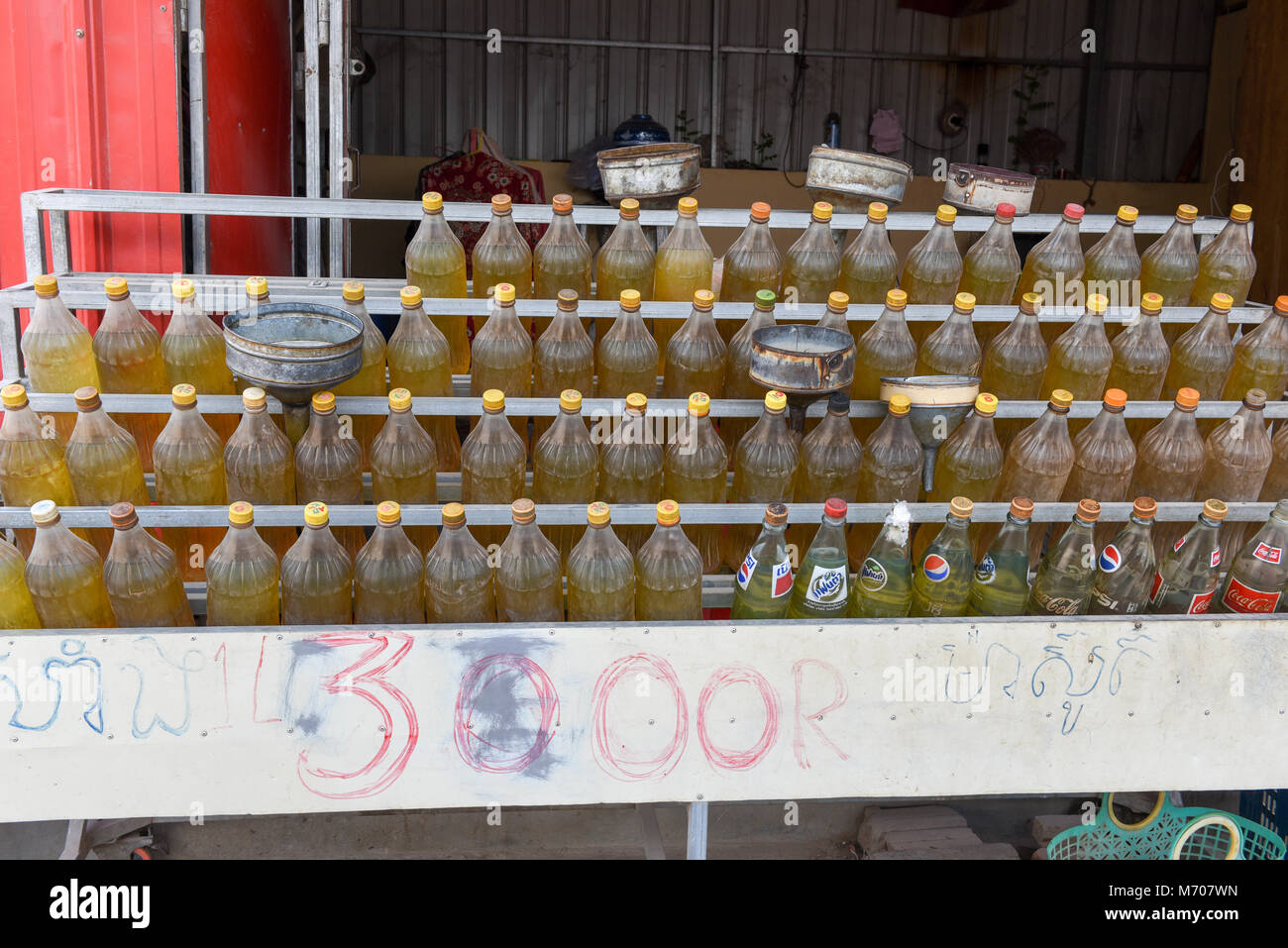 Plastic bottles with fuel on cambodian petrol station at Battambang