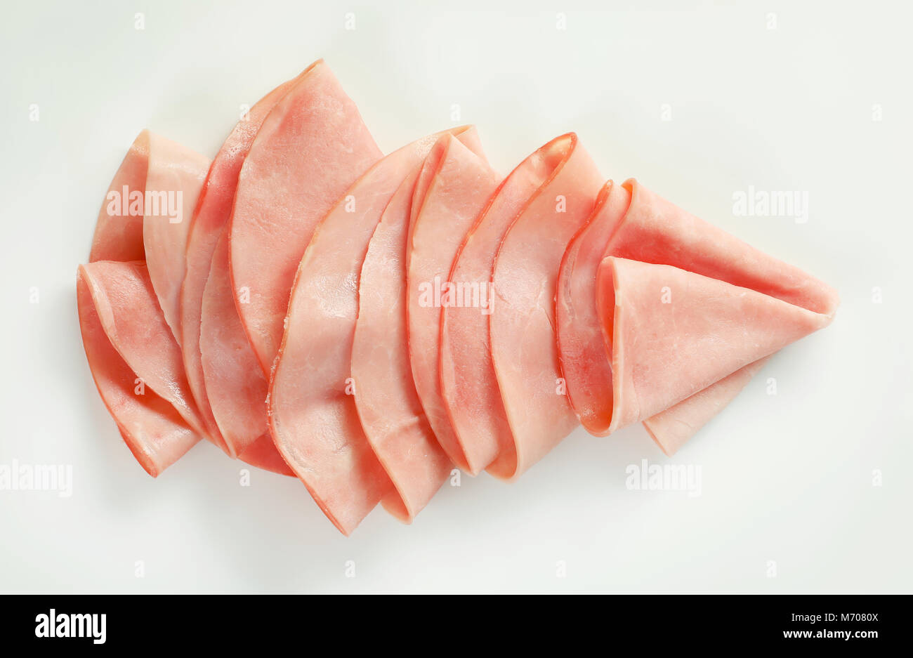 thin slices of ham arranged on white background Stock Photo - Alamy