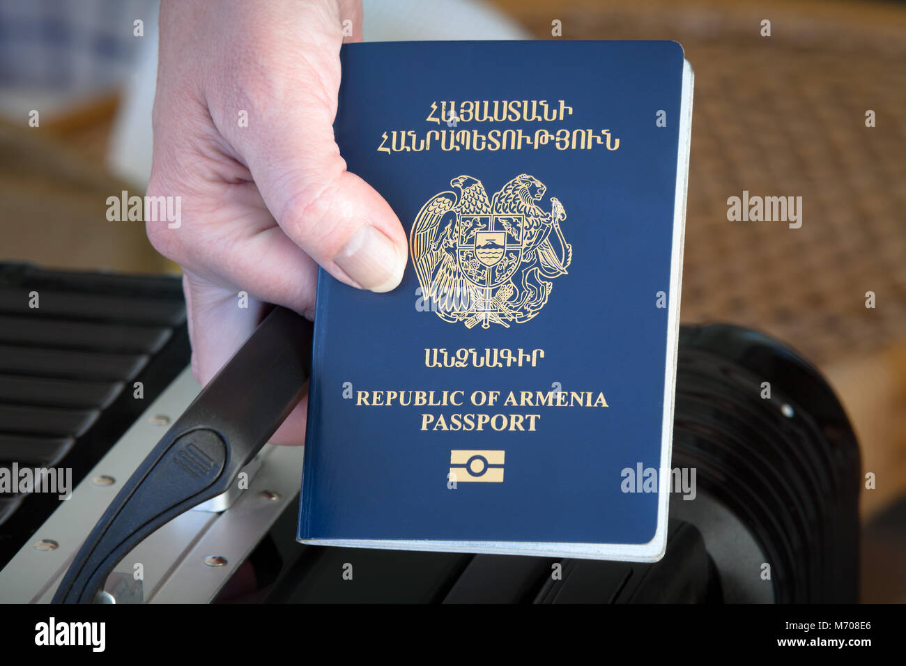 Hand holding Republic of Armenia Passport, Vacation Concept, Armenian