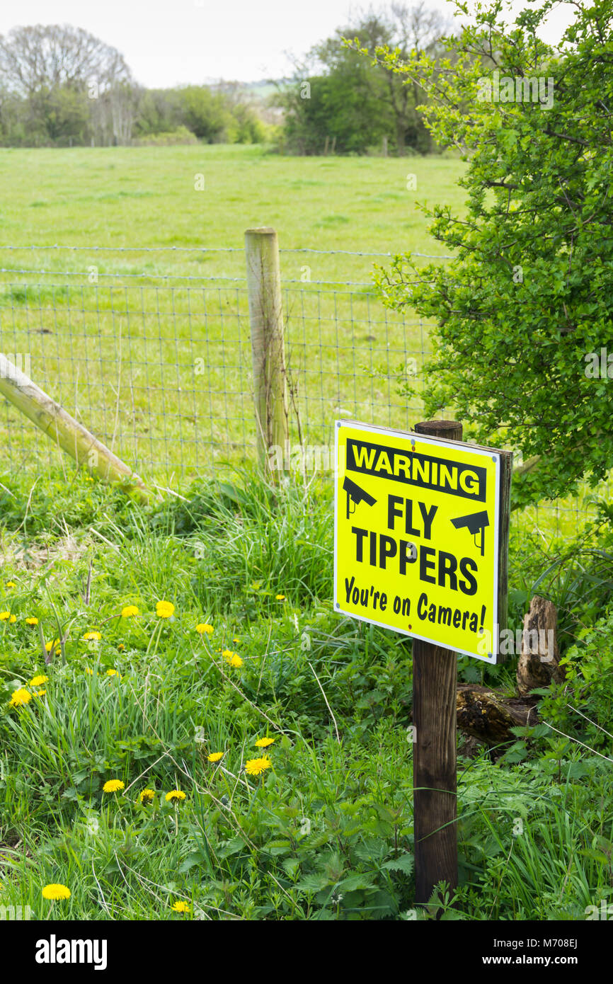 Fly tipping video surveillance warning sign at a rural layby on an unclassified lane near Coppul, rural Lancashire, Stock Photo