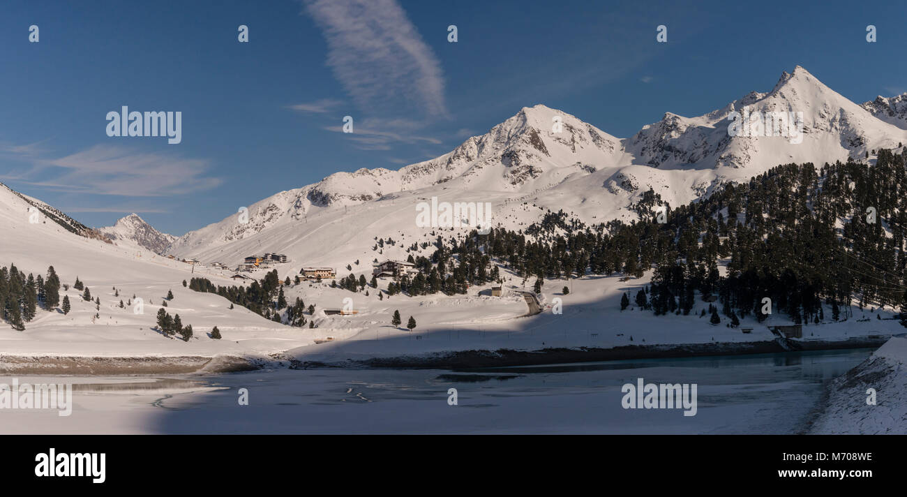 Winter snow scene panoramic in the mountains of the Sellrain Alps in the Austrian Tirol, looking towards the ski-resort area of Kuehtai Stock Photo