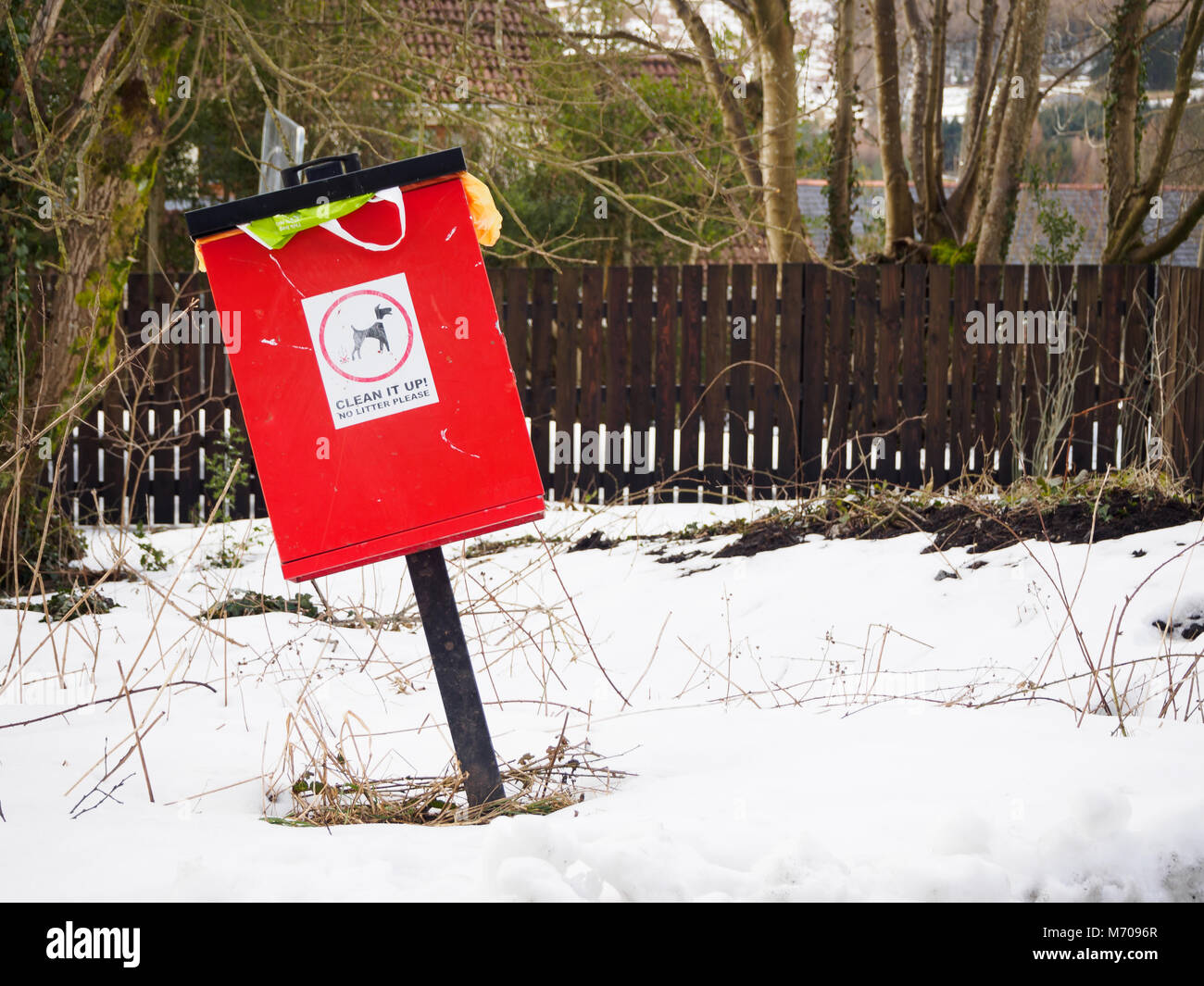 Red Dog Poo Bin in the Snow Stock Photo Alamy
