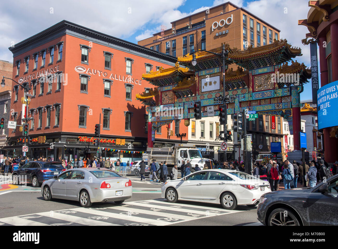 Friendship Archway, built in 1986, defines the neighborhood as Chinatown, Washingtion DC. Newly restored 19th century building at left houses small bu Stock Photo