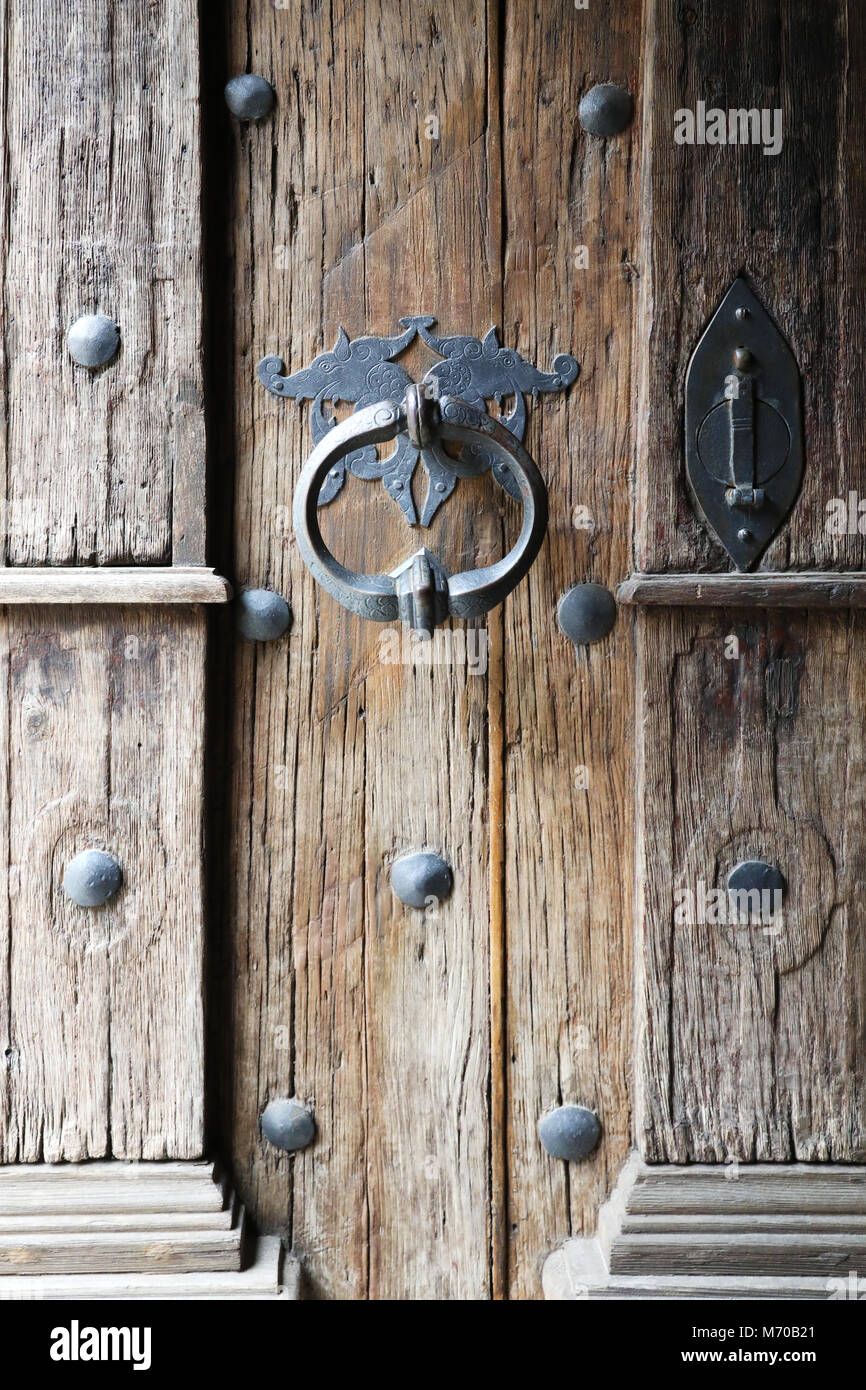 Background with wooden Gothic door and door handle Stock Photo - Alamy