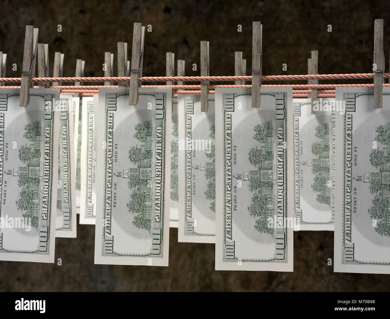 3D render of one hundred dollar banknotes hanging on laundry line attached with wooden clothes pegs against dark brown wall Stock Photo