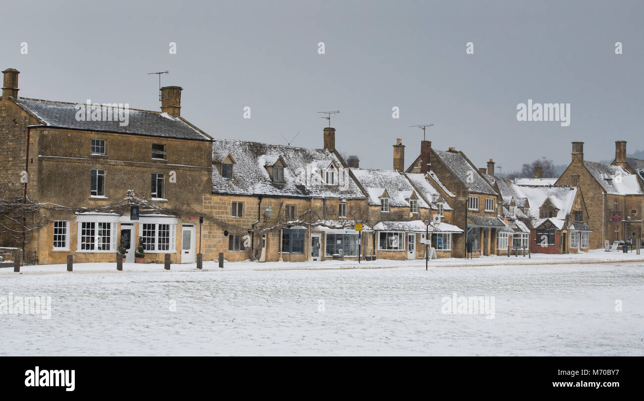 High Street shops in Broadway in the winter snow. Broadway, Cotswolds