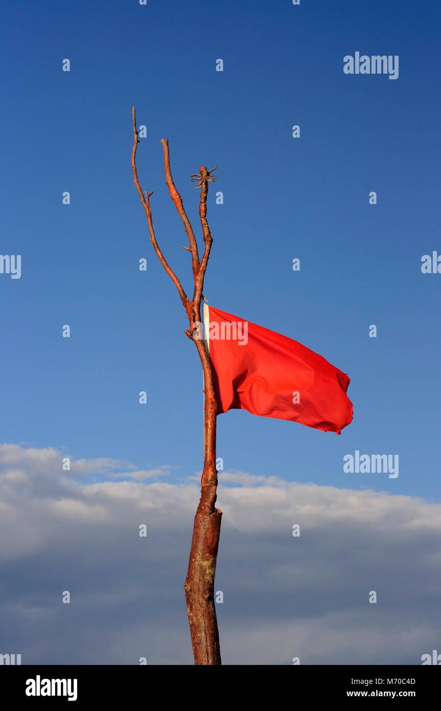 Red flag on the beach Stock Photo