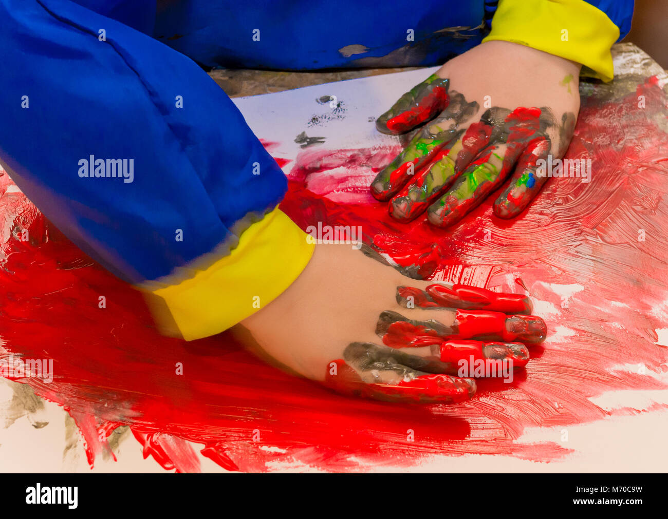 Child hands painted in colorful paints. Education, school, creativity and painting concept. Soft focus an blurry Stock Photo