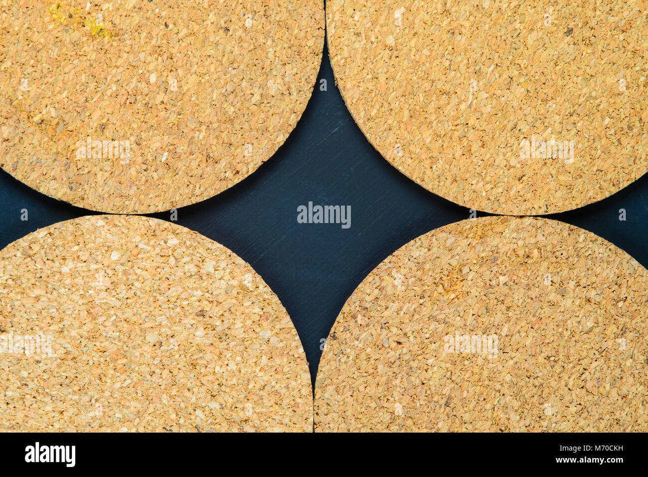 Cork drink coaster on dark blue background Stock Photo Alamy