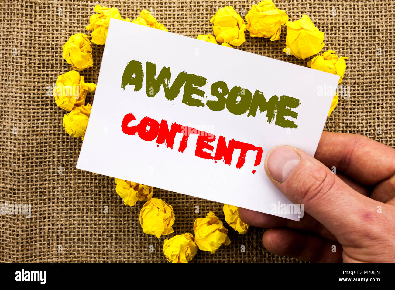 Handwritten text sign showing Awesome Content. Conceptual photo Creative Strategy Education Website Concept written Sticky Note Paper With Heart Holdi Stock Photo