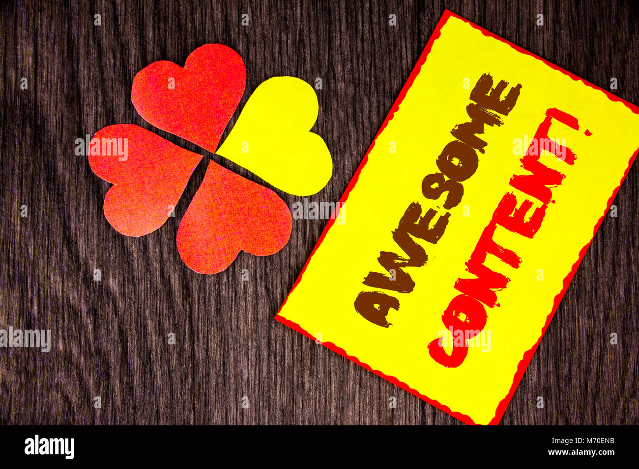 Text sign showing Awesome Content. Business concept for Creative Strategy Education Website Concept written Sticky Note Paper with Love Heart Next to  Stock Photo