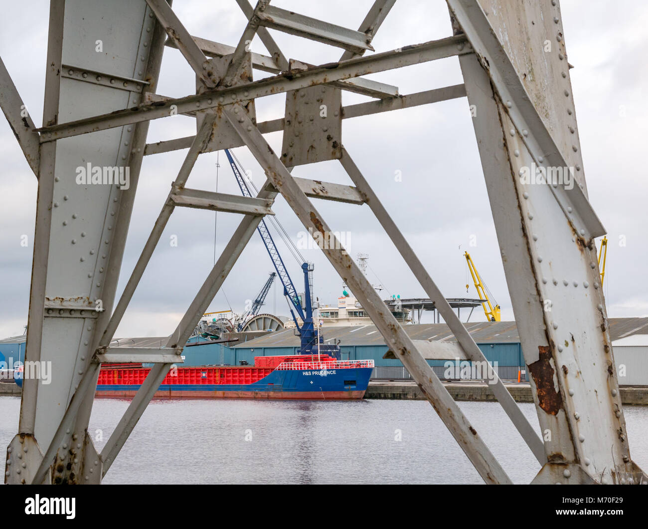 Looking through old Stothert and Pitt disused cranes to supply ships moored in port, Leith Dock, Edinburgh, Scotland, UK Stock Photo
