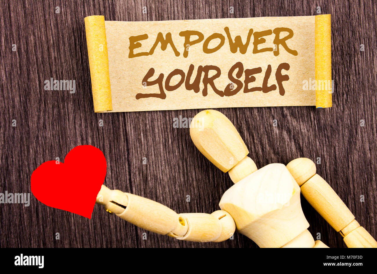 Text sign showing Empower Yourself. Conceptual photo Positive Motivation Advice For Personal Development written Sticky Note Love Heart Holding By Scu Stock Photo